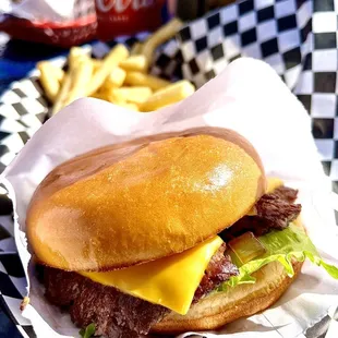 Single patty cheeseburger and fries