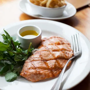 a plate of salmon and french fries