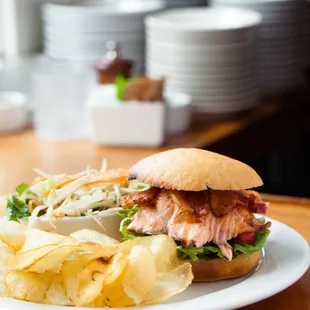 a sandwich and chips on a plate