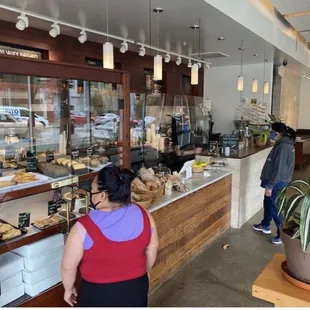 a woman standing in front of the counter