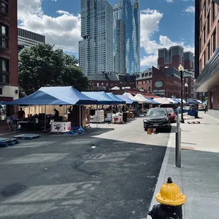 a yellow fire hydrant on a city street