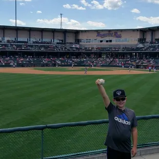 Son from OF berm with a foul ball he snagged!
