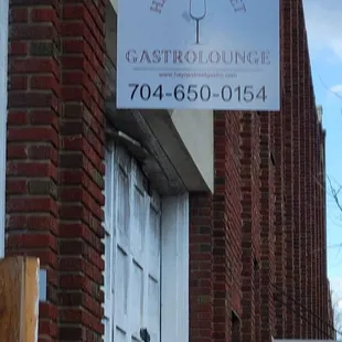 a sign on the side of a building