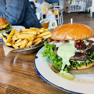 The Avocado Ranch burger (delicious) and Down on the Farm burger (amazing) with a side of fries.