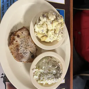 Grilled pork chop coleslaw and potato salad