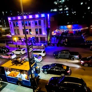 Hit the bar up then catch some of the action on the streets on the rooftop.