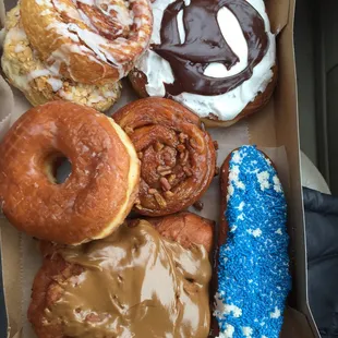 Almond pastry, cinnamon roll, frosted cow, glazed donuts, Carmel pecan roll, Maple apple fritter, frosted and sprinkles long John.