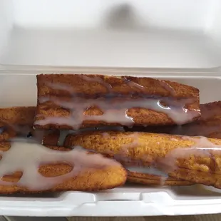a container of glazed donuts
