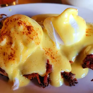 eggs benedict on a bed of hash browns