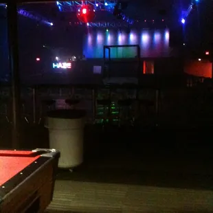 a pool table in the foreground