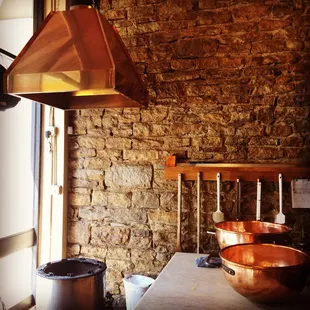 copper pans and a copper stove