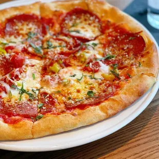 a pepperoni pizza on a plate