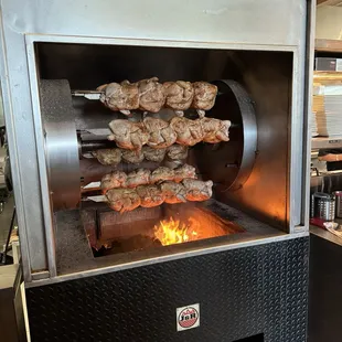 The chicken rotisserie.
