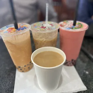 Thai Tea Smoothie with boba, iced caramel latte, strawberry &amp; banana smoothie, and Hawaiian Hazelnut coffee.