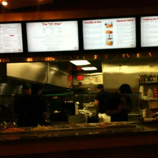 a restaurant counter and menus
