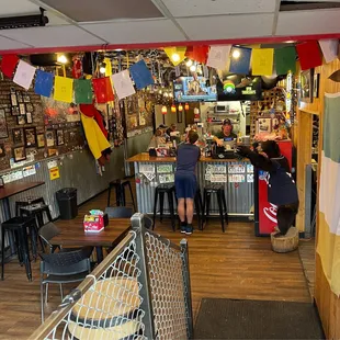 people at the counter of a restaurant