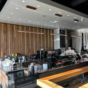 a man working at a coffee shop