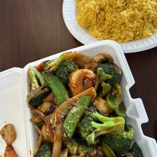 a plate of rice and broccoli
