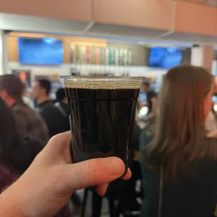 a person holding a cup of coffee