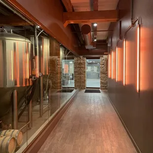 a long hallway leading to a brewery