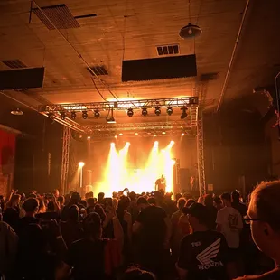 a crowd of people watching a concert