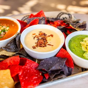 three bowls of soup and tortillas