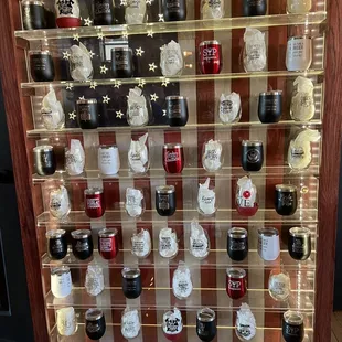 a display case with a variety of jars