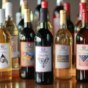 a row of wine bottles on a table