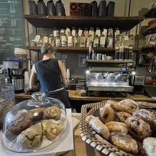 a bakery counter with a variety of pastries