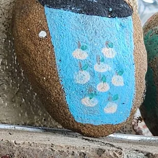 Cute hand painted rocks in drive thru window