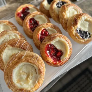 Delicious and fresh danishes: cream cheese, cherry and blackberry.