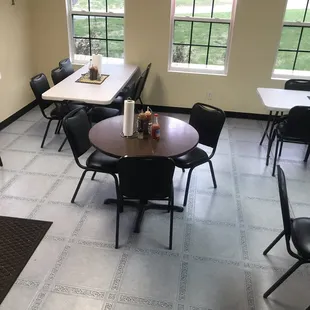 a dining room with tables and chairs