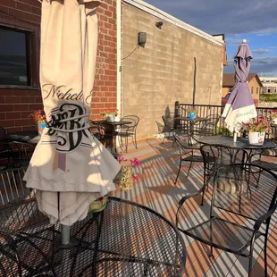 patio area with tables and chairs