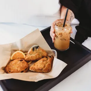 a tray of pastries and a drink