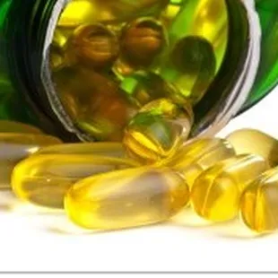 a close up of a bottle of vitamin pills