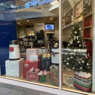 a christmas tree in a store window