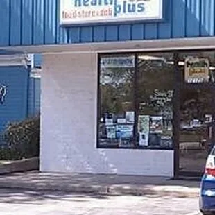 a car parked in front of the store