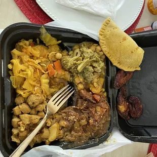 Curry unfair, cabbage, eggplant, chickpeas with veggies, in chicken patties, and plantains.