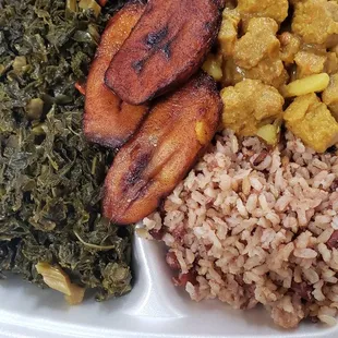 Curry goat, kale, plantains, peas/rice