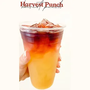 a hand holding a drink