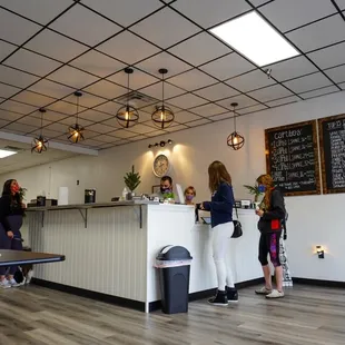 a group of people standing in front of a counter