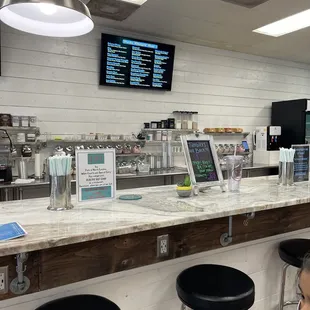 a woman sitting at a counter