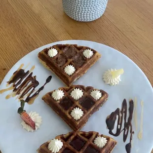 a plate of waffles on a table