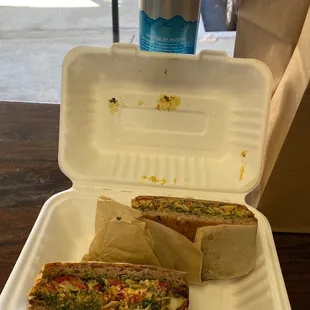 a sandwich in a styrofoam container