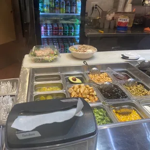 To go order for a healthy special rice bowl and Chicken Caesar Crepes and Greek Salad