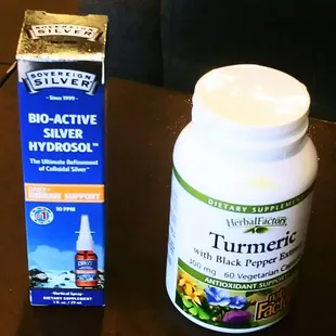 a bottle of turmeric and a box of silver