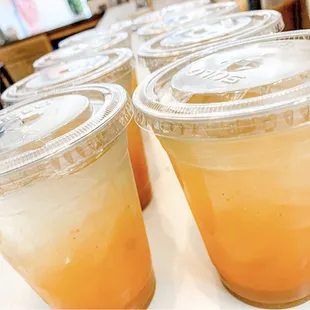 orange juice in plastic cups