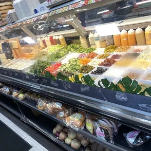 a variety of vegetables in a deli case