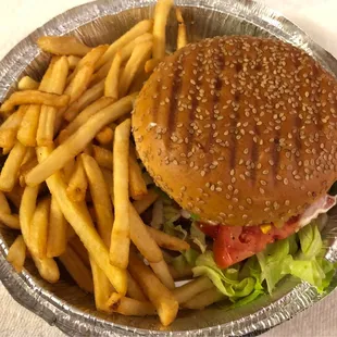 Cheeseburger with fries. Very good! Lettuce and tomato were fresh. Did NOT expect ketchup to be standard ON the burger.