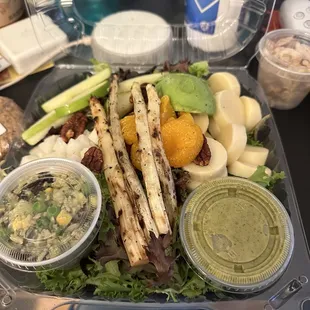 Healthyca Salad with extra heart of palm, wild rice salad, lime cilantro dressing and chipotle dressing on the other pic